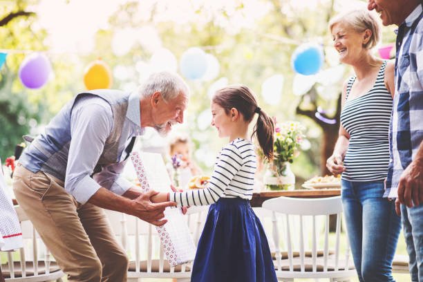 Woman at family gathering, mid-sentence, reaching for a word