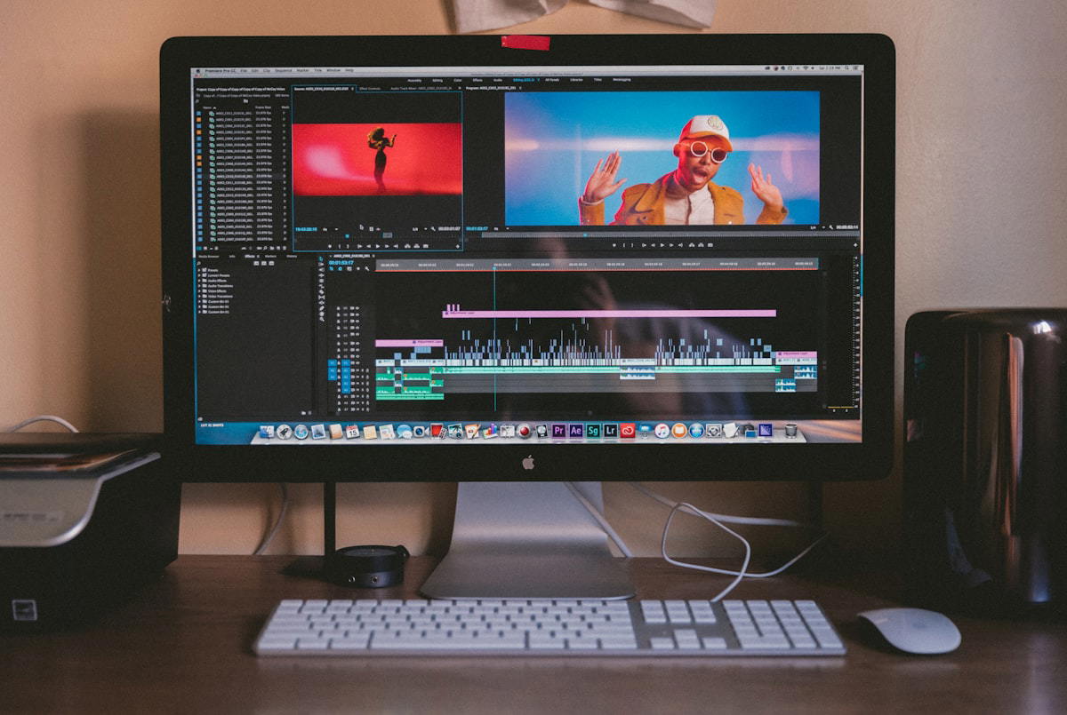 Person editing video on a laptop