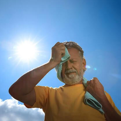 Man wiping his sweat