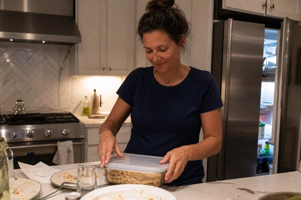 Putting leftovers away after dinner without going back for more